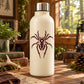 Spider decal with large warning-style spider silhouette in dark red on white bottle