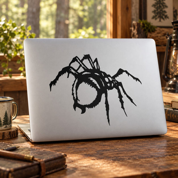 Menacing spider decal sticker, black cartoon spider on white laptop