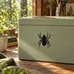 Crawling spider wall decal, black spider silhouette on light green background
