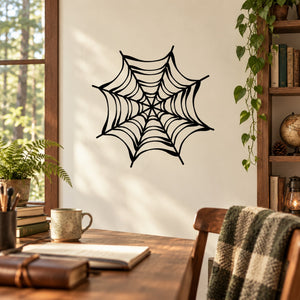 Black spider web decal with central hub and web strands on a wall