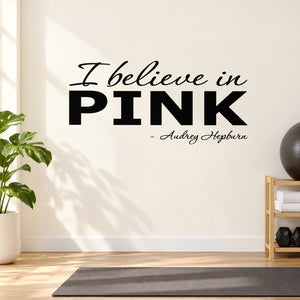 Pink wall decal text: 'I believe in PINK' with Audrey Hepburn