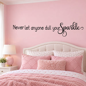 Black wall decal with “Never let anyone dull your” text and sparkle flourish