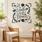Black floral wreath wall decal with script quote and roses