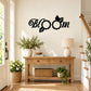 Bloom flower wall decal with black typography and two daisy-like blossoms