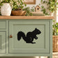 Black squirrel wall decal with bushy tail and small heart detail
