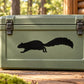 Black running squirrel silhouette decal on green rectangular surface