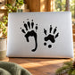Black squirrel paw print decal with three paw prints on a light surface