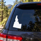 Idaho state silhouette decal on dark car rear window