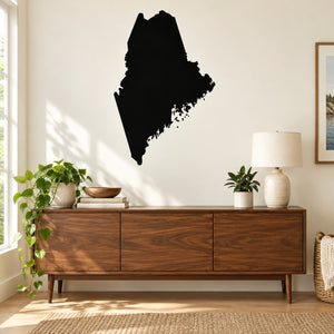 Maine state decal with dark silhouette of Maine shape