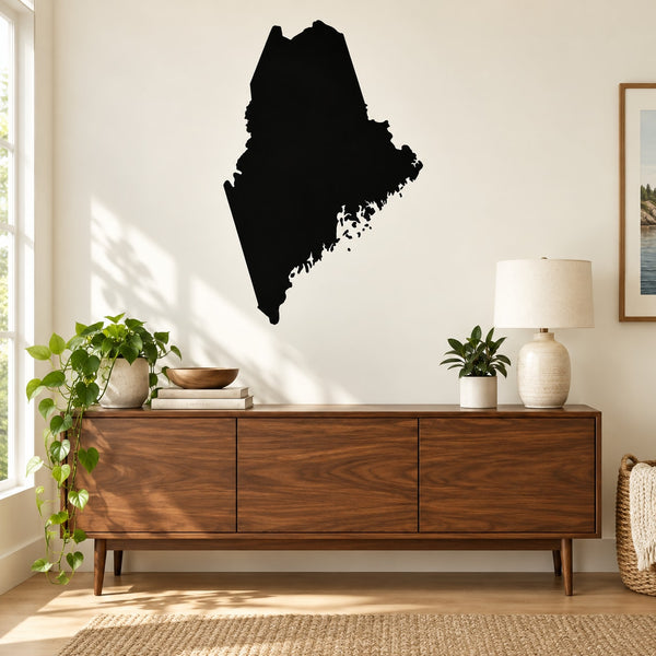 Maine state decal with dark silhouette of Maine shape