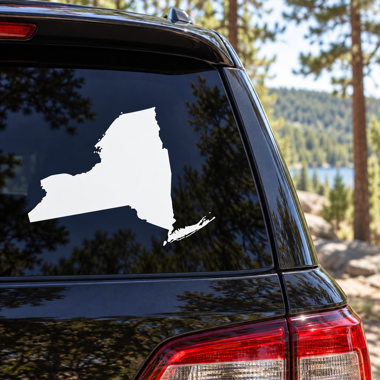 New York State silhouette decal on car rear window, white design