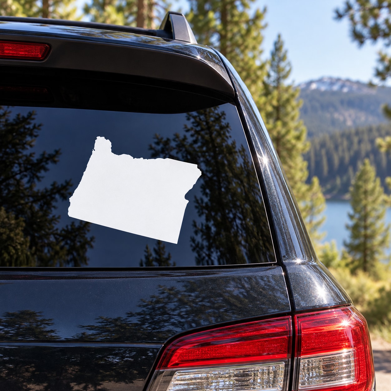 White Oregon State decal on car rear window