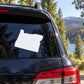 White Oregon State decal on car rear window