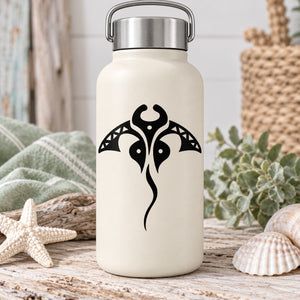 Black manta ray decal with tribal-style tail on a white bottle