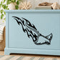 Black flaming stingray decal on light blue cabinet front