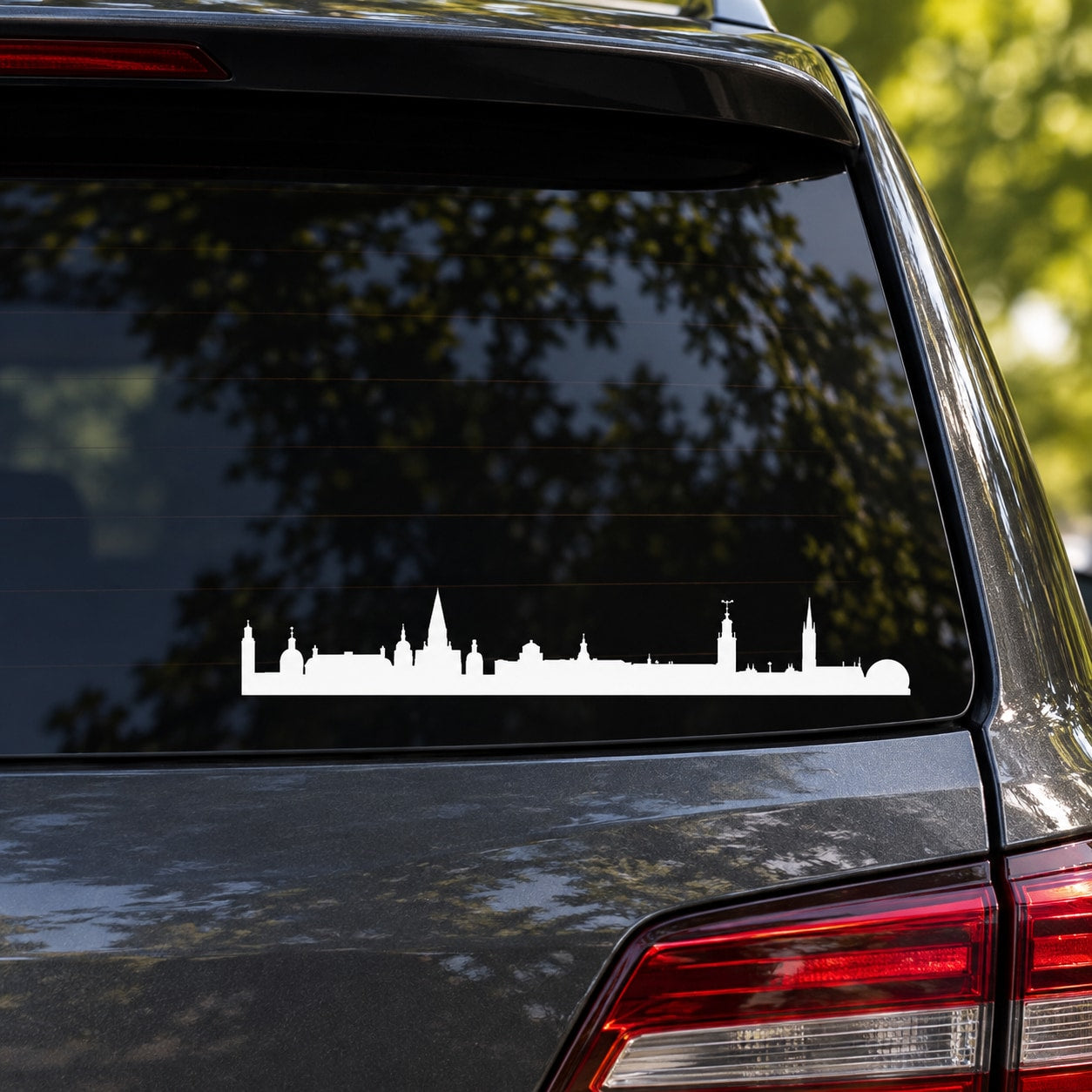 White skyline car window decal with Stockholm-style building silhouettes