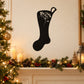 Black stocking decal with floral ornament design on top and swirled details