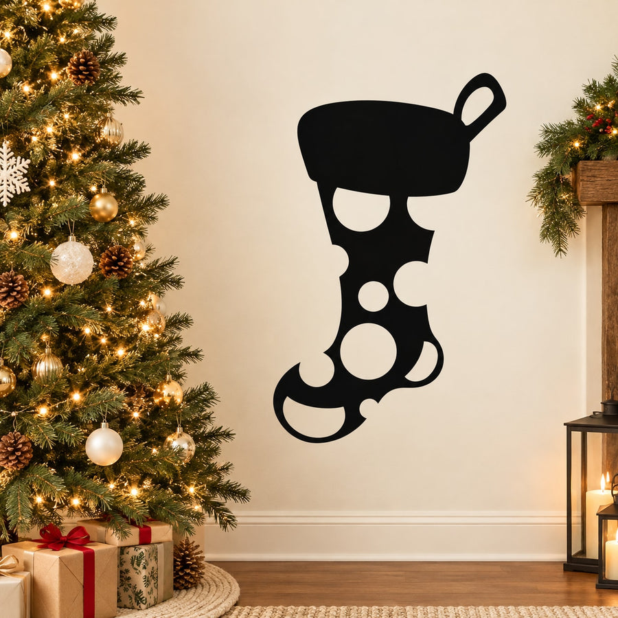 Black stocking-shaped dot decal with circular spots and hanging loop