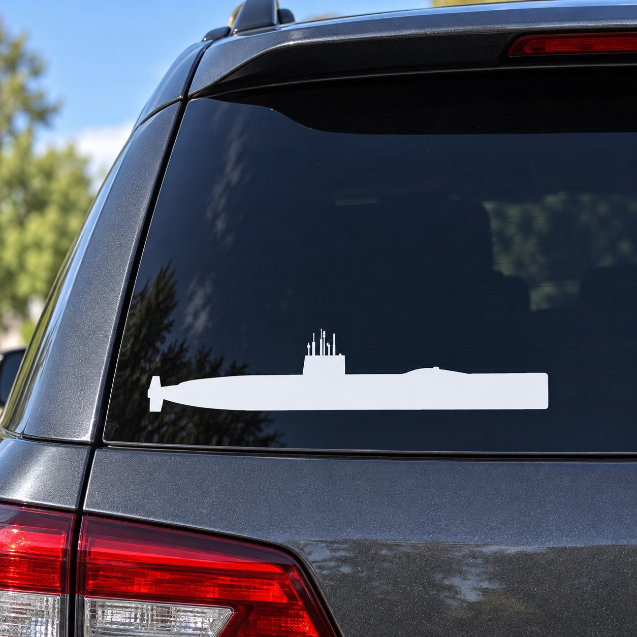 Submarine silhouette decal on a car rear window, white graphic