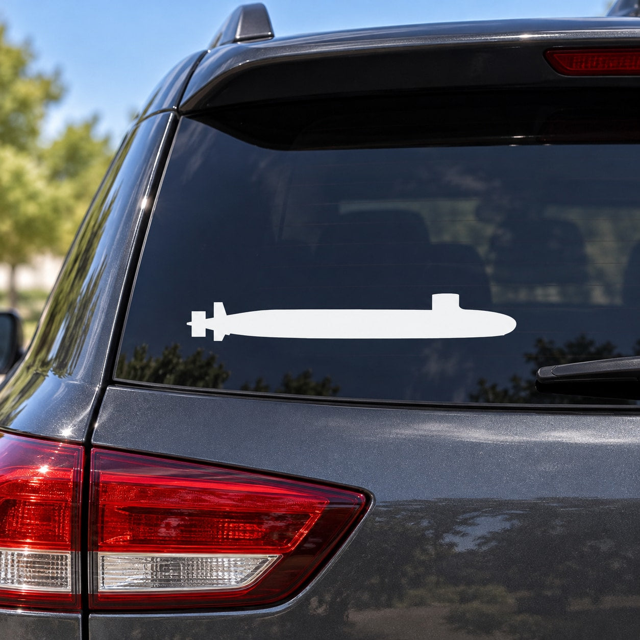 White submarine silhouette car decal on rear window