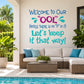 OOL welcome wall decal with teal and blue text: 'Let's keep it that way!'