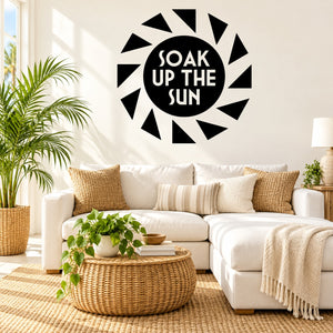 Black sunburst wall decal with white text: SOAK UP THE SUN