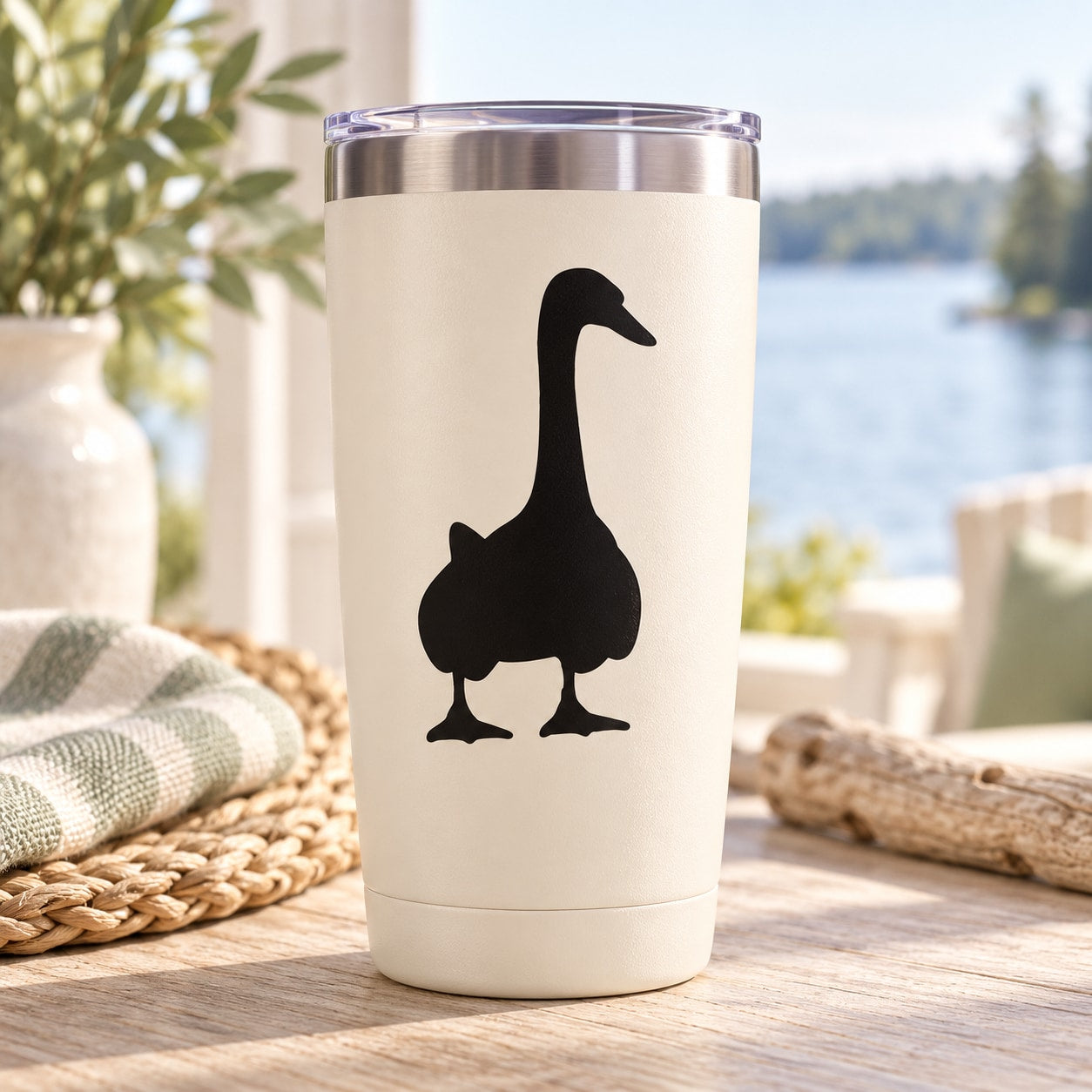 Waddling duck decal silhouette on a white tumbler cup