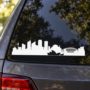 White skyline silhouette decal on car window, rectangular shape