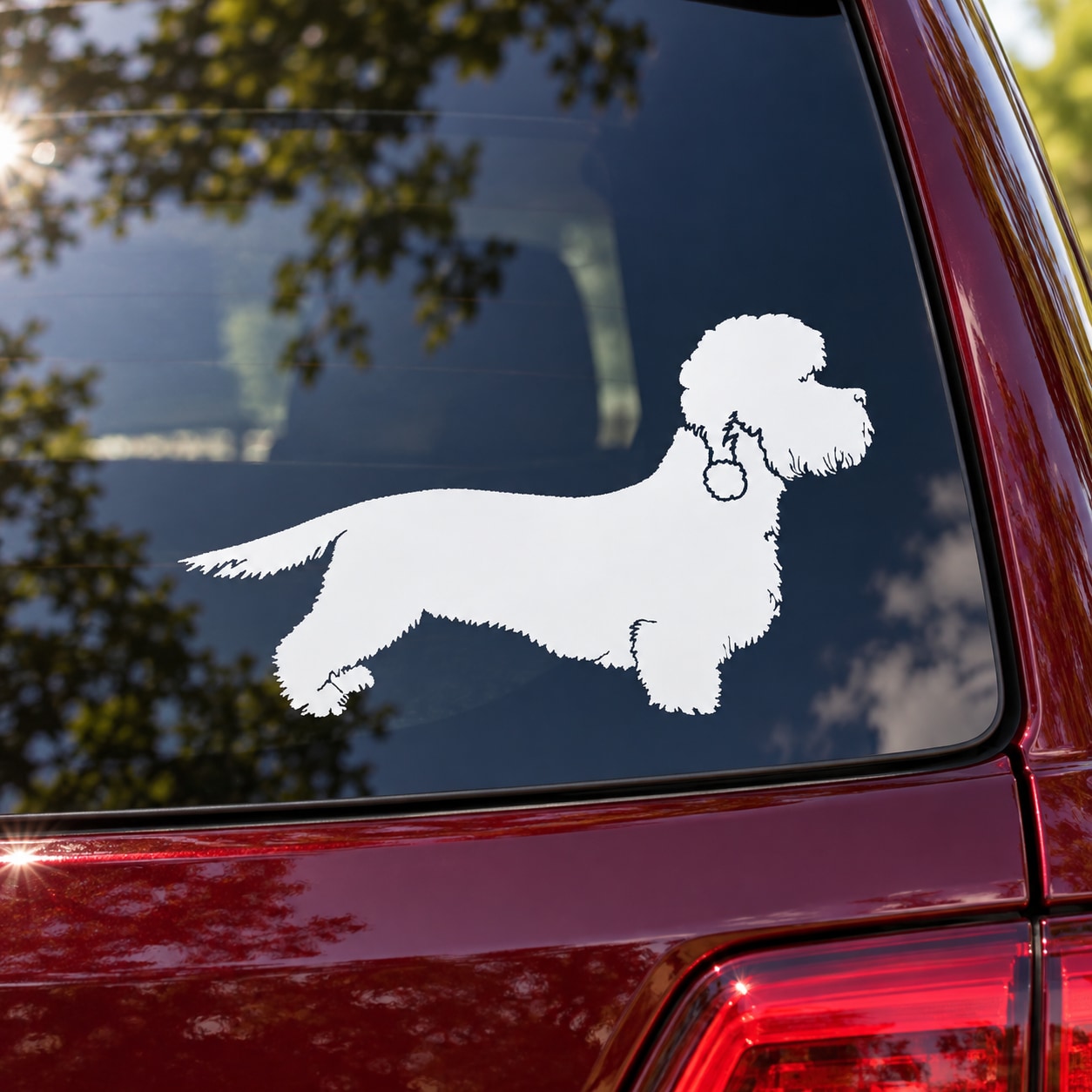 White dandie dinmont terrier decal silhouette on car window
