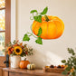 Thanksgiving pumpkin sticker with green vines and orange carved pumpkin design