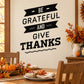 Thanksgiving wall decal: black ribbon text 'Be Grateful and Give Thanks'.