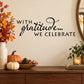 Thanksgiving gratitude wall decal with 'WITH gratitude... WE CELEBRATE' in black script