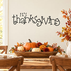 Thanksgiving wall decal with bouncy 'It's Thanksgiving' script and autumn leaves