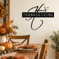 Thanksgiving wall decal reading 'It's Thanksgiving' in black script and framed text