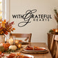 Thanksgiving wall decal with “With Grateful Hearts” black lettering