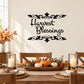 Thanksgiving wall decal with black 'Harvest Blessings' script and leaf corner flourishes