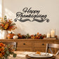 Happy Thanksgiving wall decal in black cursive lettering with decorative swirls and flourish