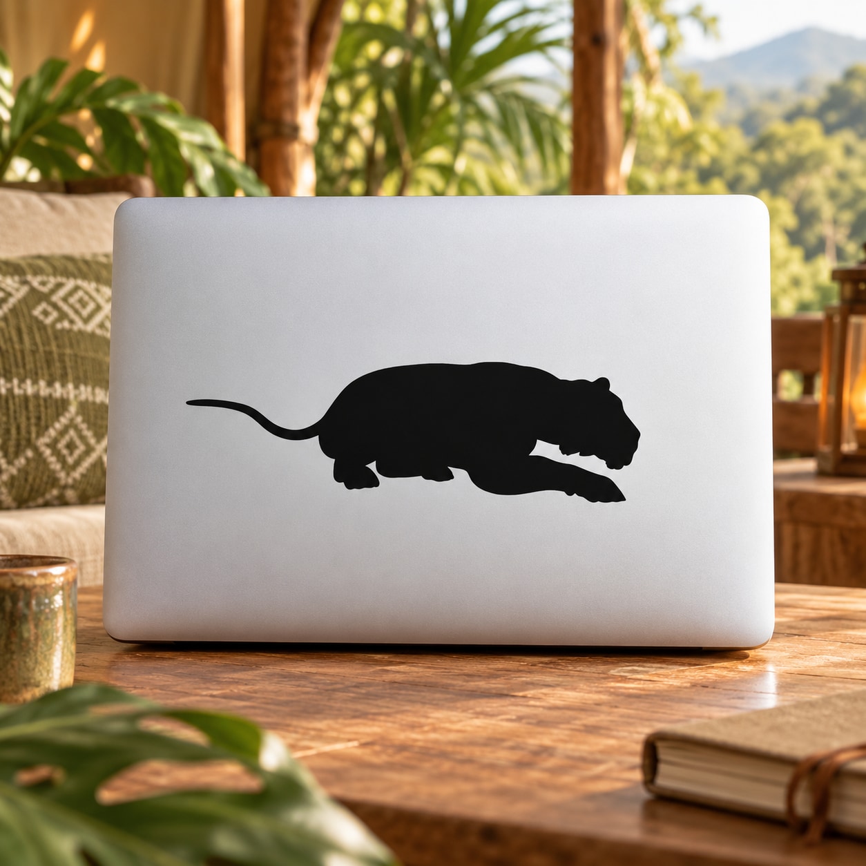 Crouching tiger decal with a black silhouette, placed on a laptop lid