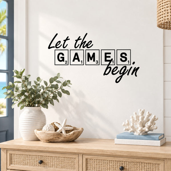 Wall decal: "Let the games begin" lettering in outlined letter boxes