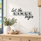 Wall decal: "Let the games begin" lettering in outlined letter boxes
