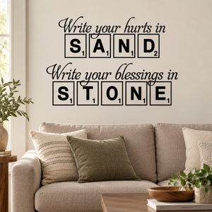 Wall decal with cursive quote: write your hurts in sand and blessings in stone.