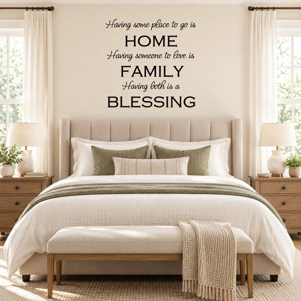 Wall decal text: HOME, FAMILY, and BLESSING with cursive quote above bed