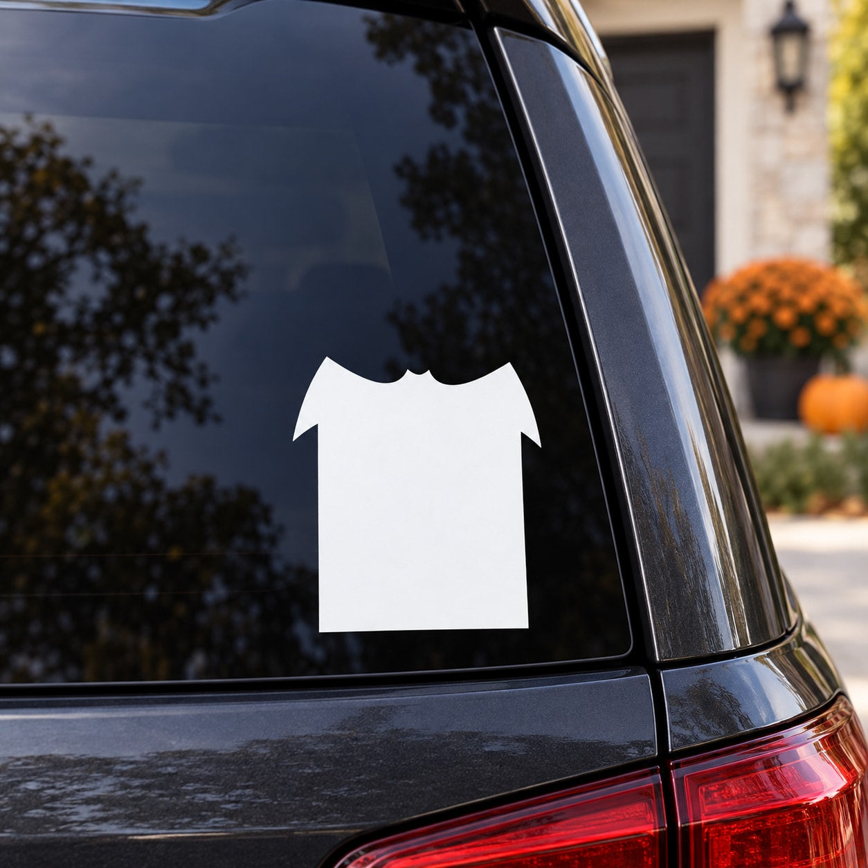 White bat tombstone decal on car window, bold silhouette
