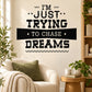 Inspirational wall decal with bold black text: I'm Just Trying to Chase Dreams