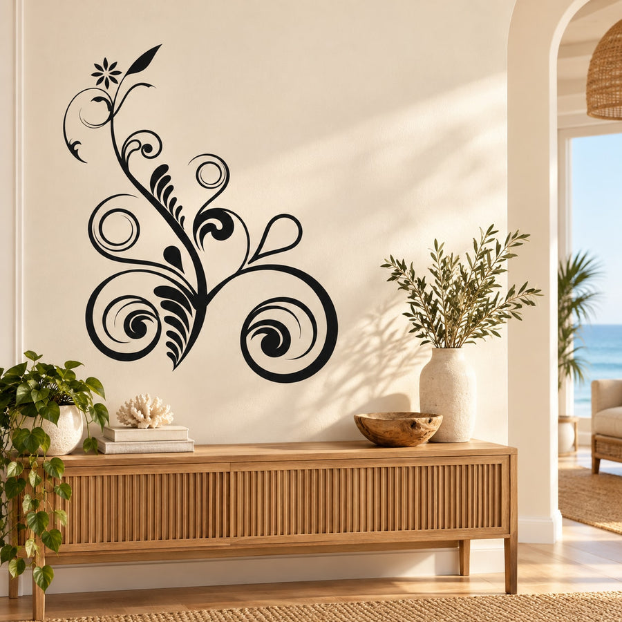 Black tree branch wall decal with swirling vines and leaf accents