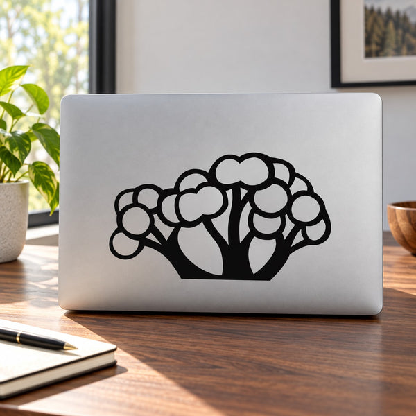 Black tree vinyl decal with rounded, cloud-like foliage on a smooth surface