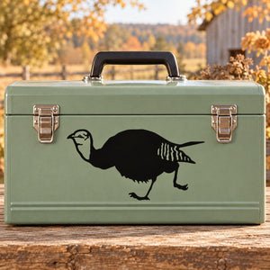 Sprinting turkey hen decal with black running silhouette on green suitcase