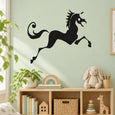 Black unicorn leaping wall decal with curled tail and mane silhouette