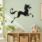 Black unicorn leaping wall decal with curled tail and mane silhouette