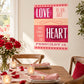 Feb 14 heart-themed sticker with pink hearts and 'LOVE...HEART' typography